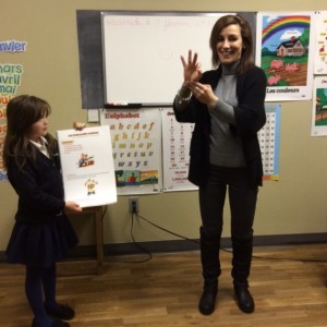 Mme Borges demonstrates AIM French with gestures.